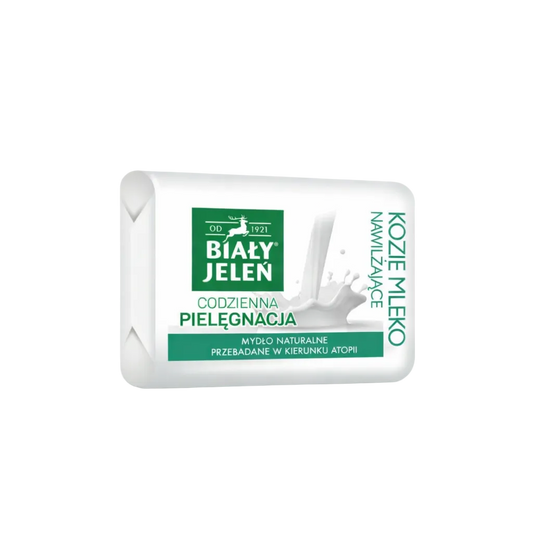 Bar of soap with a white and green label on a light gray background