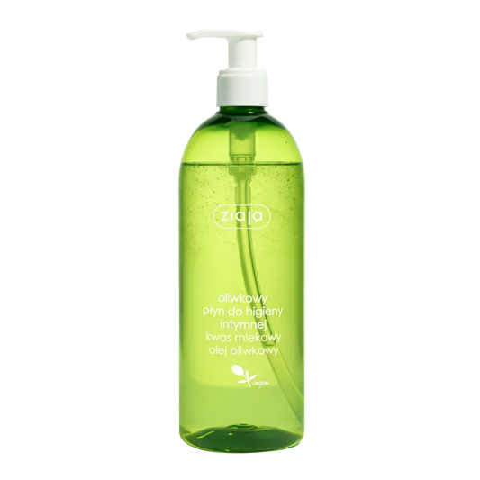 Green bottle with pump dispenser on a light green background