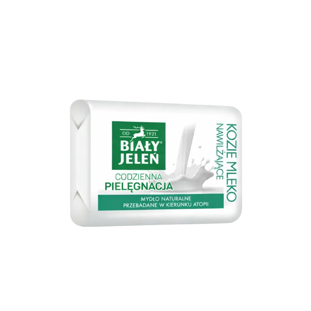 Bar of soap with a white and green label on a light gray background