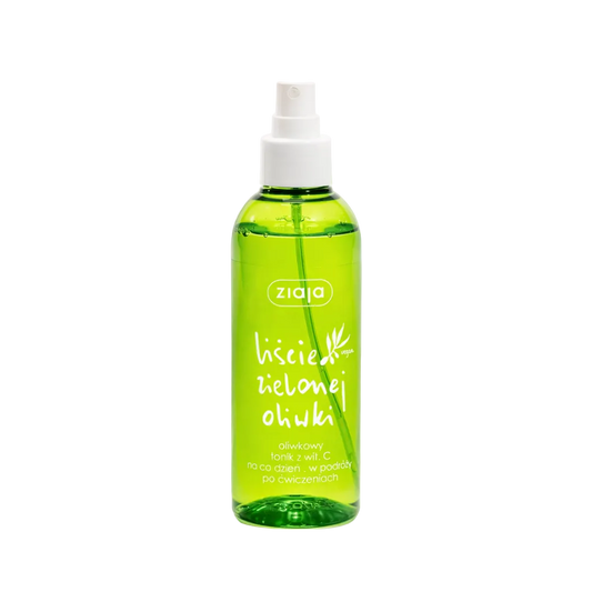 Green spray bottle with white nozzle on a white background
